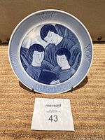 Front view of plate showing angel motif and JUL 1922 inscription