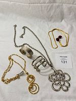 All five jewelry pieces arranged for overview