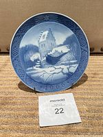 Front view of Royal Copenhagen 1966 Christmas plate on stand