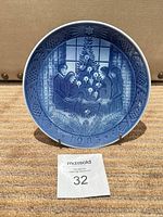 Front view of Royal Copenhagen 1983 Christmas plate on stand