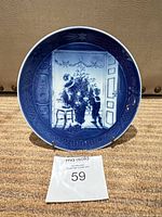 Front view of plate on stand showing full design and year 2000