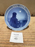 Full front view of plate showing scene, date inscription and stand