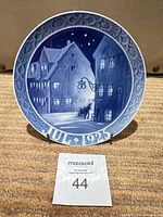 Front view of Royal Copenhagen JUL 1925 plate on stand