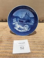 Front view showing relief scene and 1999 date