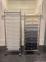Front view of both chrome-frame carts showing 20 drawers and wheels