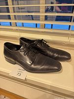 Side view of both shoes showing overall condition and style