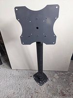 Front view of steel pipe ceiling mount with VESA plate