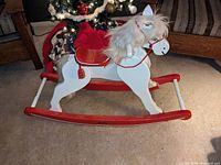 Full side view of wooden rocking horse