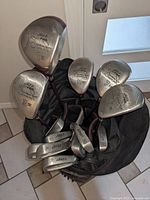 Top view of bag showing driver, woods and irons with Jazz SP Pro Sandra Post markings