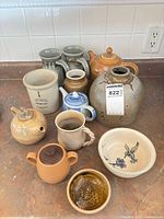 Group shot of all twelve pottery items on countertop