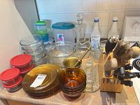 Overall lot showing glassware, knife block, containers