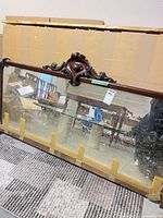 Full view of mirror with carved crest showing size and overall condition