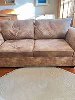 Front view of loveseat showing cushions and upholstery