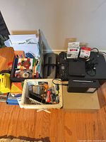 Overall view of lot showing printers, stationery, batteries and accessories