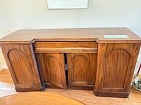 Front view of sideboard showing four doors and overall design