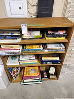 Front view of bookcase showing all shelves filled with books