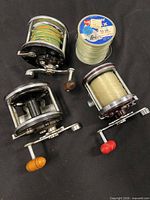 Group shot of three reels and line spool