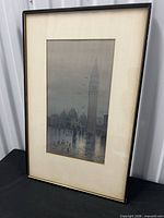 Full view of framed artwork with mat and metallic frame