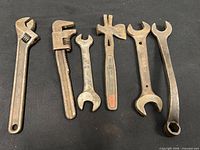 full view of six tools on black background