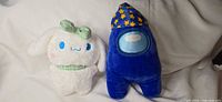 Front view showing both plush toys side by side
