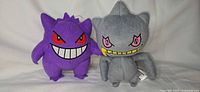 Front view of both plush toys