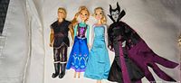 All four Disney dolls laid out side by side