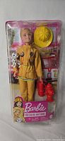Full front view of packaged firefighter Barbie doll and accessories