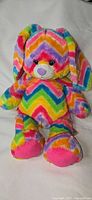 Front view of multicolor chevron bunny plush sitting upright