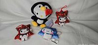 Group shot of all four Sanrio plush toys