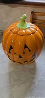 Front view of Pfaltzgraff ceramic jack-o-lantern cookie jar with lid