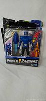 Front view of packaged Beast-X Blue Ranger figure and accessories