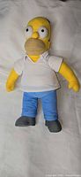 Front view of 18-inch Homer Simpson plush showing clothing and overall condition