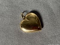 Front view of yellow gold heart pendant