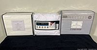 Three sealed sheet sets side by side