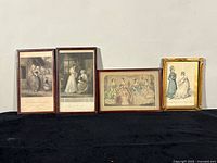 Front view of four framed fashion plate prints