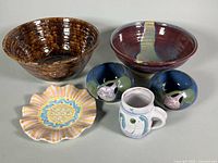 Group shot of six pottery pieces