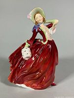 Front view of Royal Doulton Autumn Breezes figurine showing full pose and colors