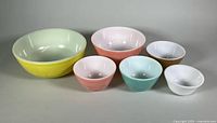 Group shot of six coloured Pyrex mixing bowls