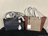 Front view of both handbags with tags attached