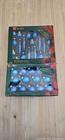 Two boxed sets of blue glass ornaments, overview