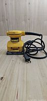 Front view of DeWalt DW411 palm sander with power cord
