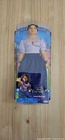 Front view of packaged Disney Encanto Luisa Madrigal doll