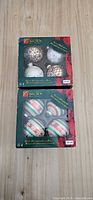 Two boxed sets of glass ornaments, eight pieces total