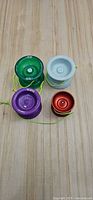 Group shot of all four yo-yos showing colors and sizes