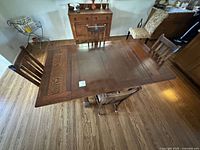 Top view of wood dining table with four matching chairs