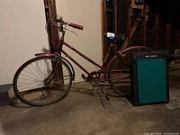 Schwinn step-through bicycle and Pet Gear dog ramp standing upright