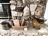 Full lot view on hearth showing pair of brass andirons, coal scuttle, and bugle