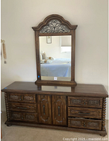 Dresser with mirror showing carved details and finish