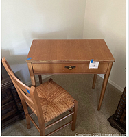 Wood makeup table front view with drawer, brass pull, and matching chair