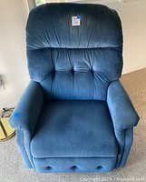 Front view of blue upholstered recliner armchair